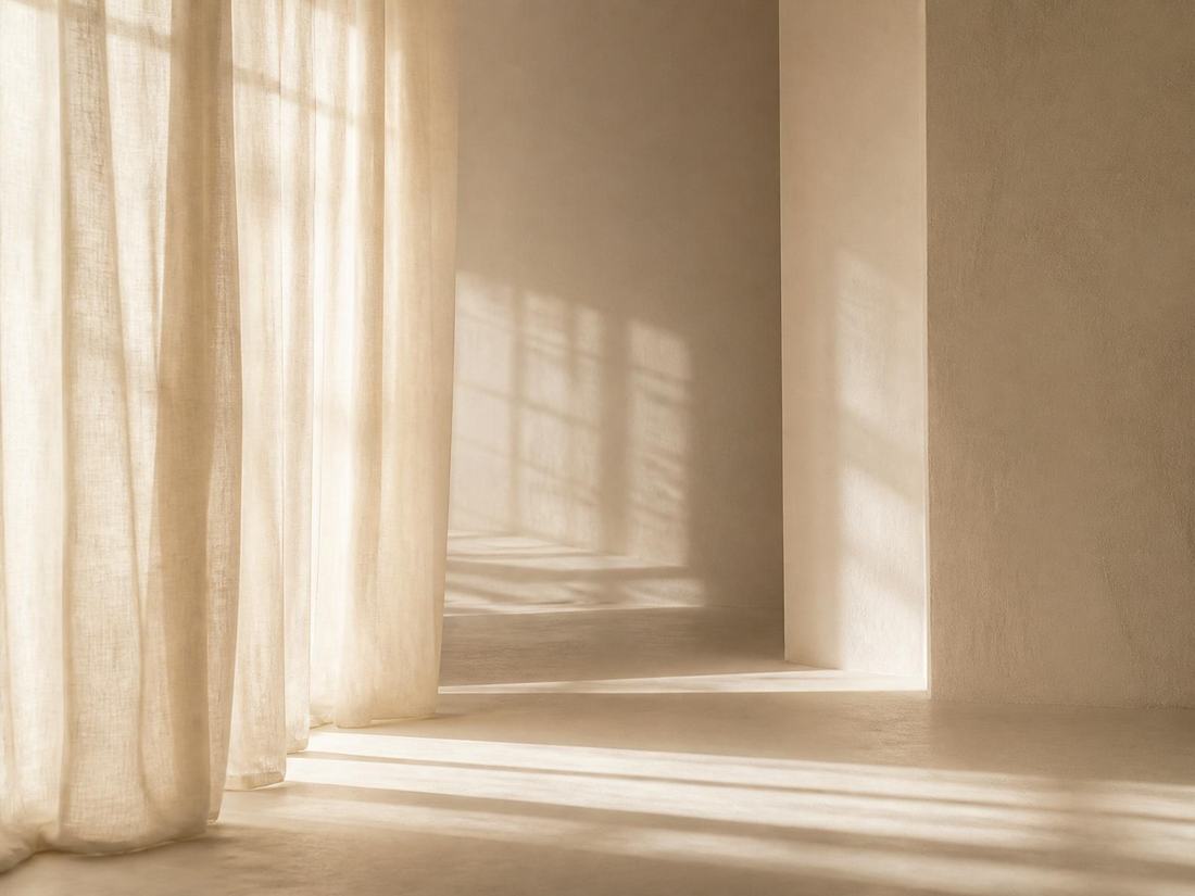 Soft morning light through sheer linen curtains